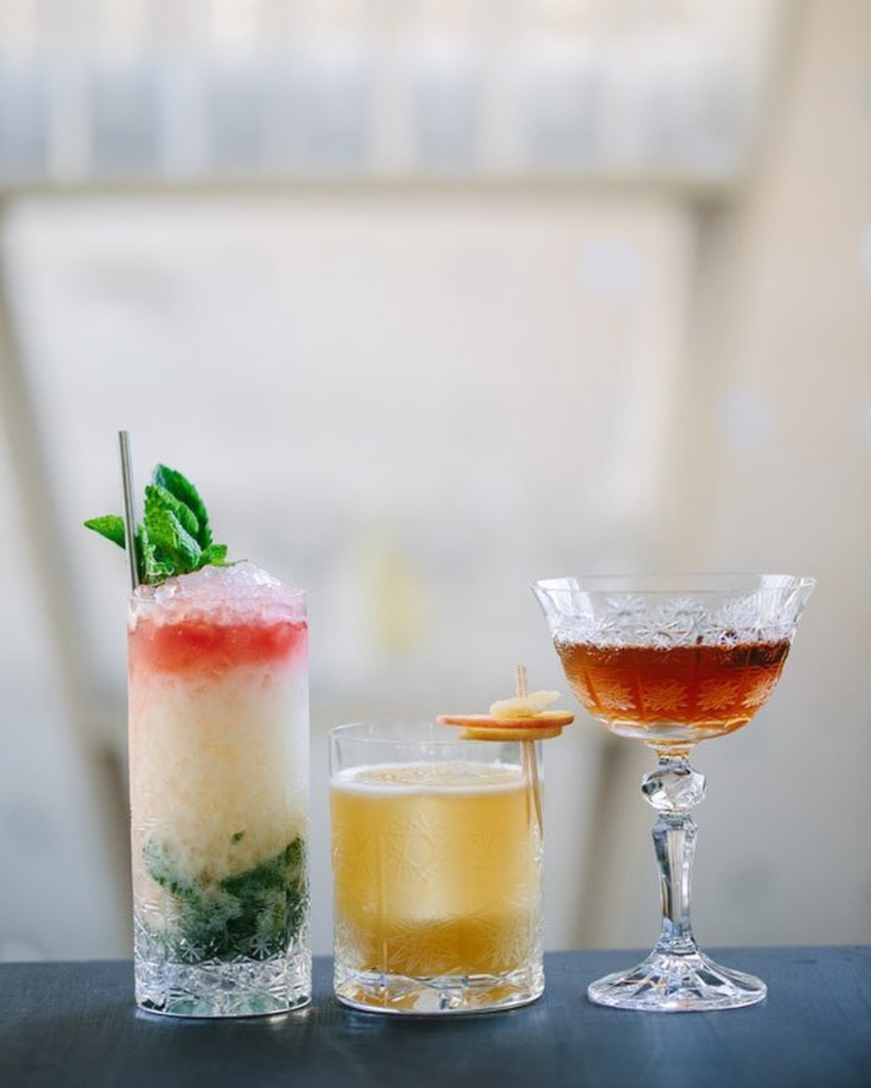 3 cocktails in different types of glass