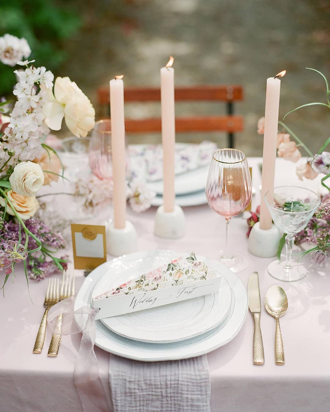 spring wedding place setting with a botanical fan menu, gossamer ribbon and textured flowers