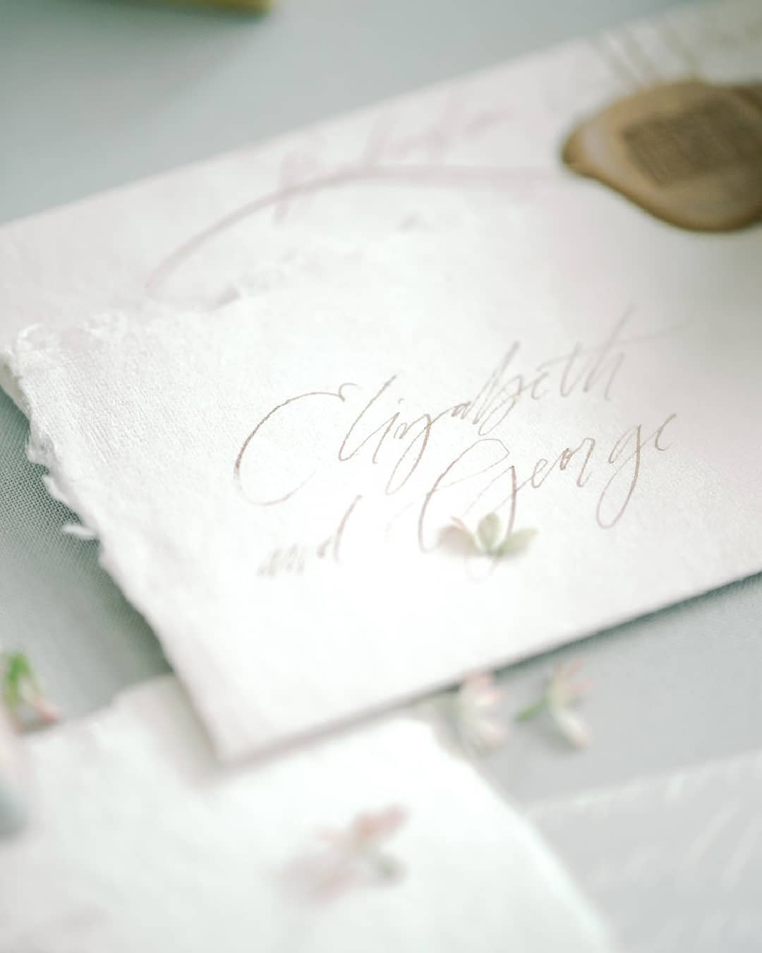 calligraphed wedding invitations with a brass wax seal