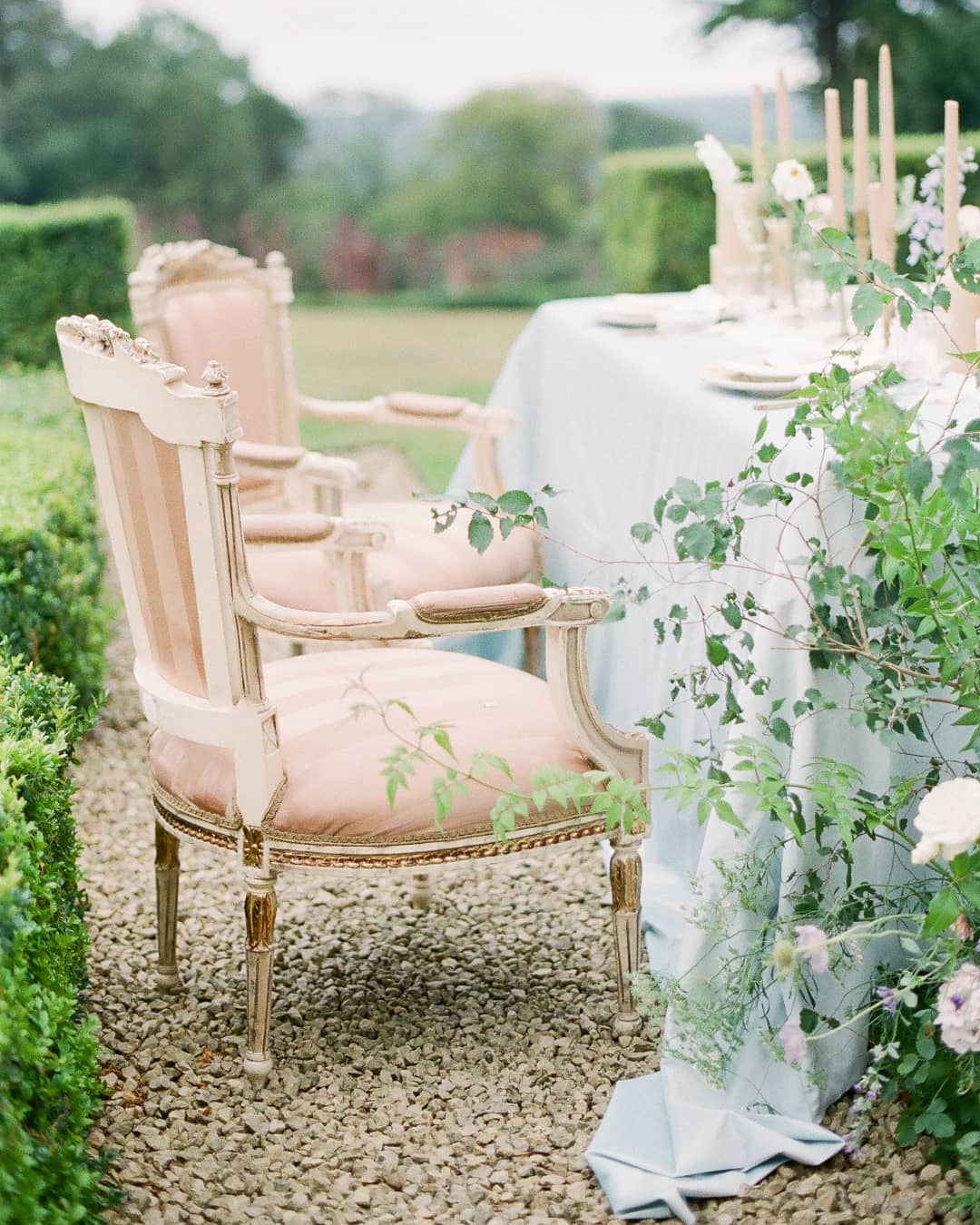 vintage Europan arm chairs for a wedding tablescape in a garden