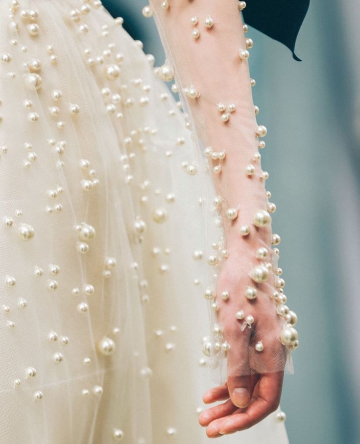 Today we're talking all about texture and design in the scope of wedding planning, and this pearl embellished wedding dress from Reem Acra is the picture perfect example of why this design element makes all the difference in the world #weddingdresses #luxurywedding #couturegown // Willow & Oak Events