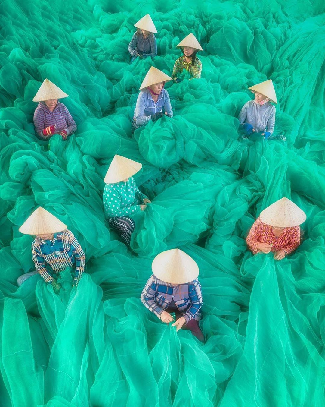 Today we're talking all about texture and design in the scope of wedding planning, and this vibrant teal fabric in Vietnam is the picture perfect example of why this design element makes all the difference in the world #fabricproduction #luxurywedding #weddingdesign // Willow & Oak Events