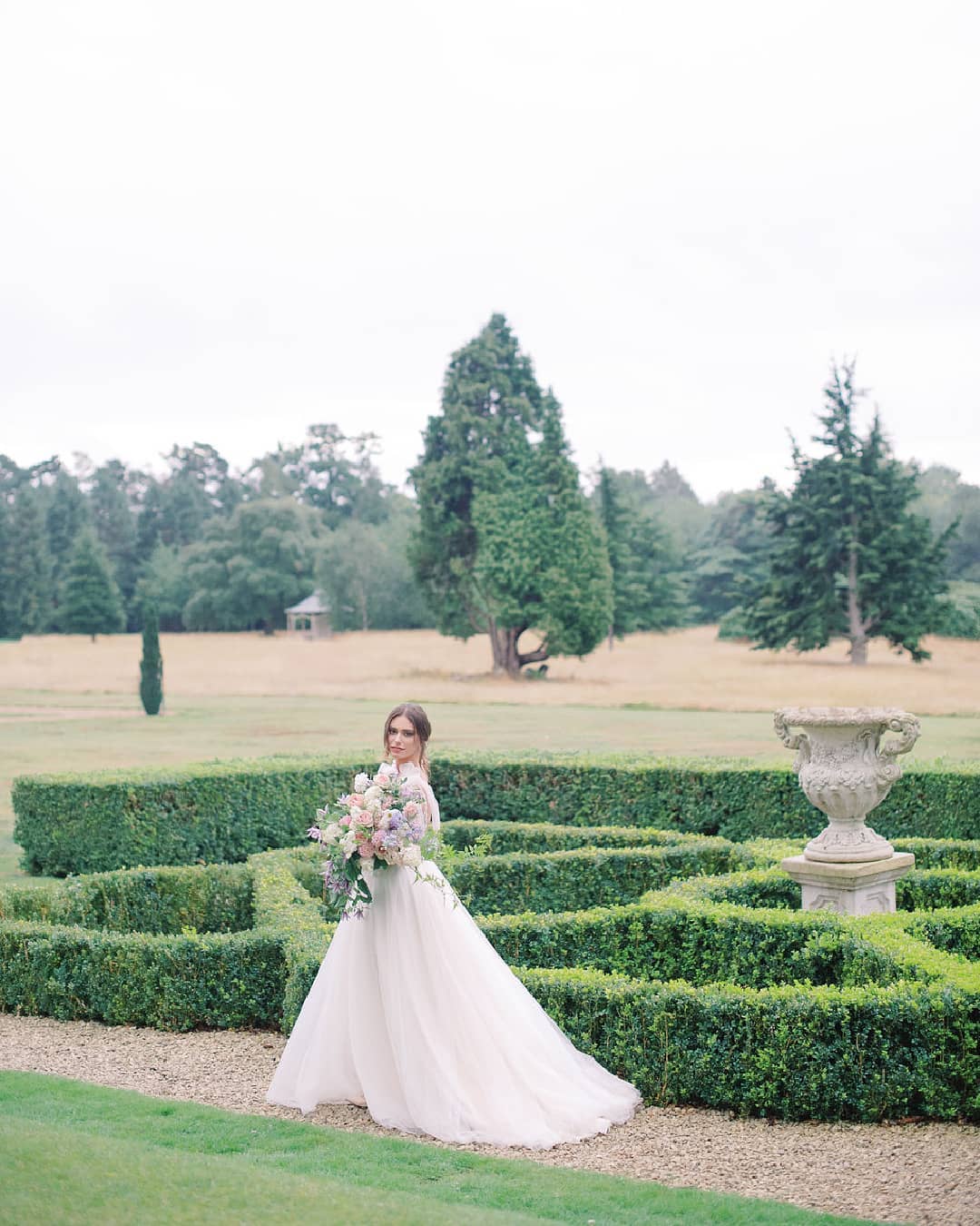 Ines di Santo bridal gown with tulle bow straps and a lush garden bridal bouquet from Moss & Stone at an English country estate, Hedsor House; captured by Julie Livingston and styled by Willow and Oak Events