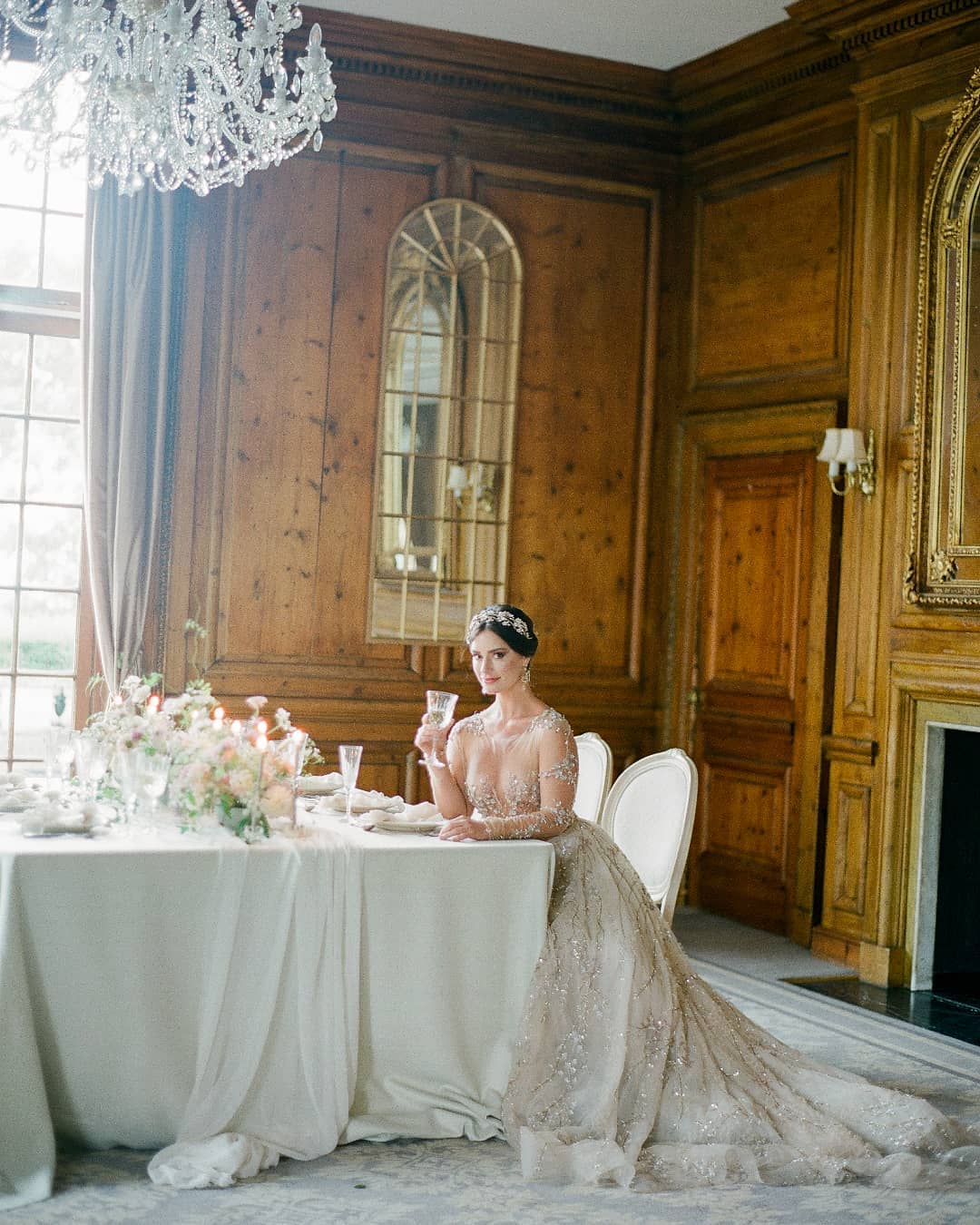 English manor house ballroom wedding reception with elegant tablescape and pastel centerpieces, plus a bride in a haute couture Lee Petra Grebenau wedding dress with crystal vine embellishments; captured by Julie Livingston at Hedsor House with styling from Willow and Oak Events