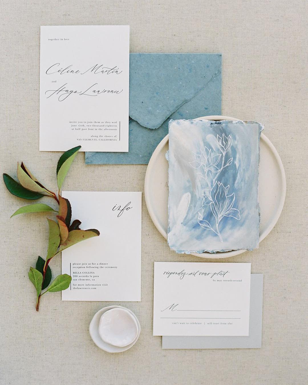 Elegant wedding invitations with deckle edge envelopes and a dusty blue art card by Dominique Alba | Photography and styling by  Sara Weir