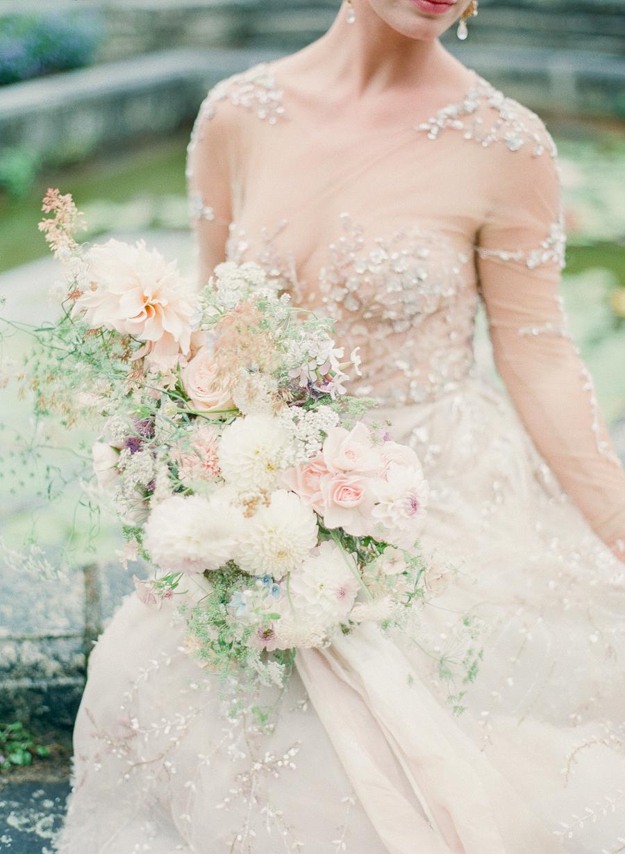 Luxury English garden wedding with a Lee Petra Grebenau bridal gown and a wild bouquet with dahlias, roses and baby's breath by Moss & Stone || Photography by Julie Livingston with planning + design by Willow and Oak Events