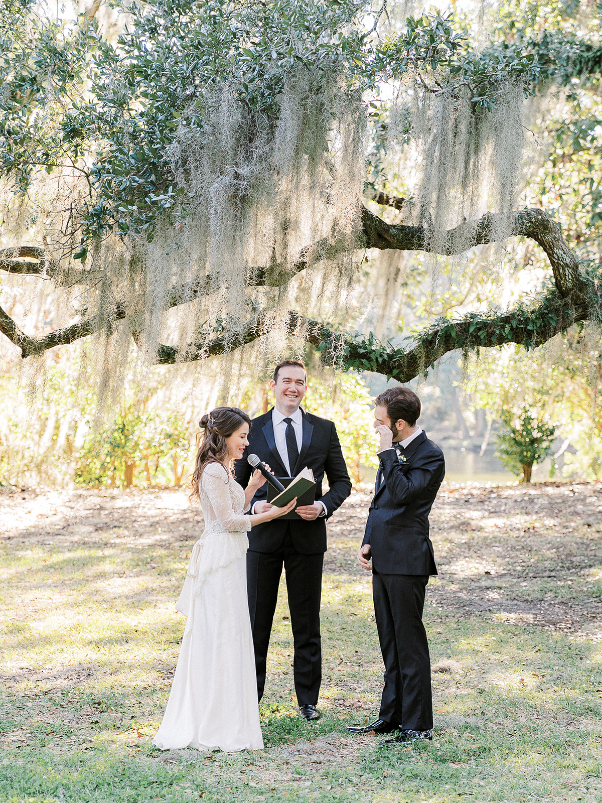 Winter wedding in Charleston with a vintage inspired wedding dress and black groom tux, designed by destination wedding planner Willow and Oak Events and captured by Kylee Yee Photography