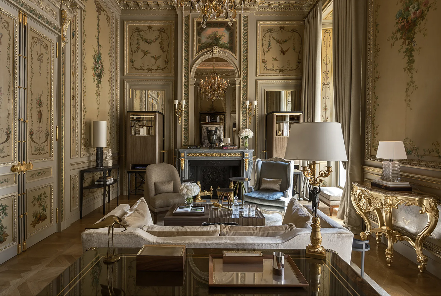 An opulent Louis XV inspired living area of one of the suites at Hotel de Crillon in Paris