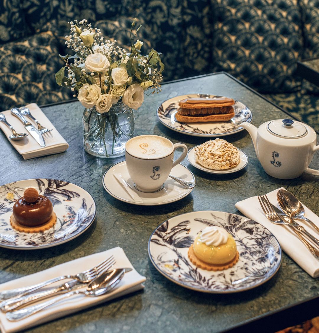 Vintage floral blue and white plates for tea time pastries at Café Lapérouse
