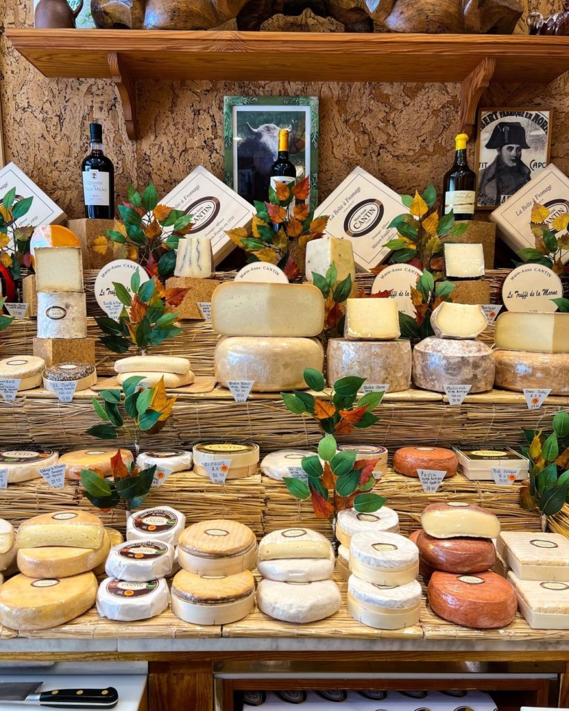 A corner of Marie Anne Cantin's famous fromagerie in Paris with a wide selection of hard and soft cheeses 